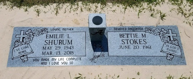 Flat companion headstone with vase and cross carvings